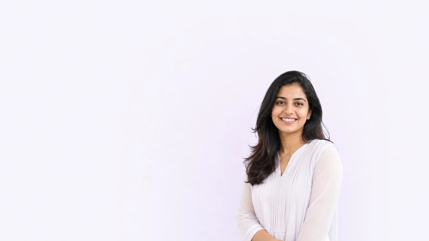 Smiling Kerala woman in elegant white clothing